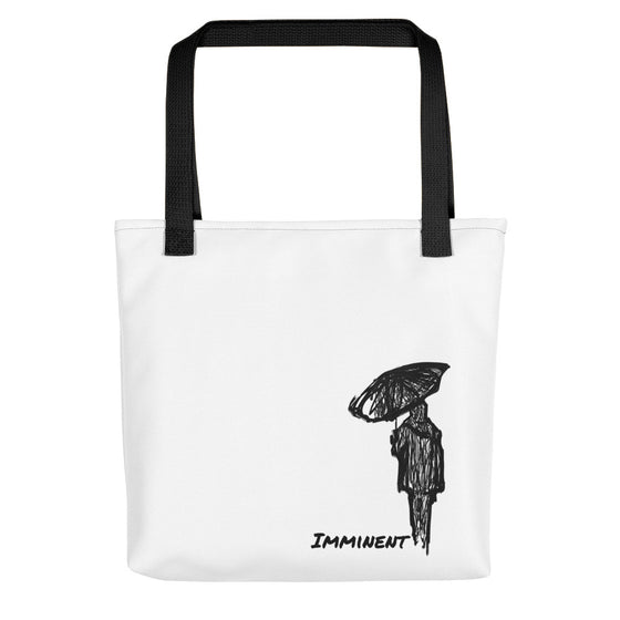 White tote bag with black straps with the graphic of a woman holding an umbrella walking away and the text reading IMMINENT