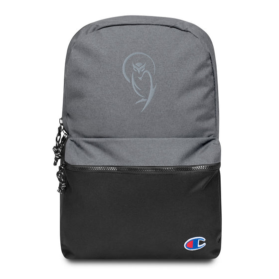 Gray and black champion backpack with an embroidered light gray owl graphic behind a moon