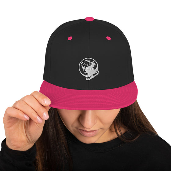 Black baseball hat with logo of a man's face behind the moon
