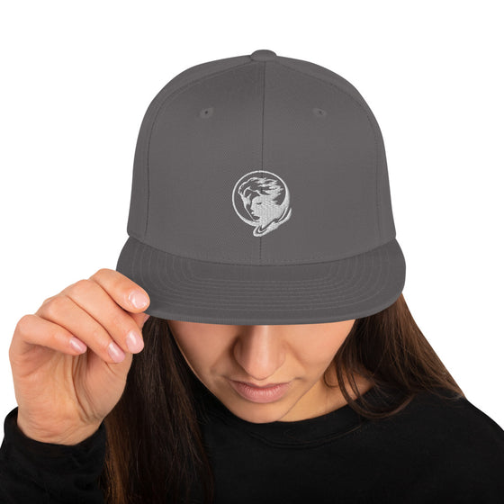 Grey baseball hat with logo of a man's face behind the moon