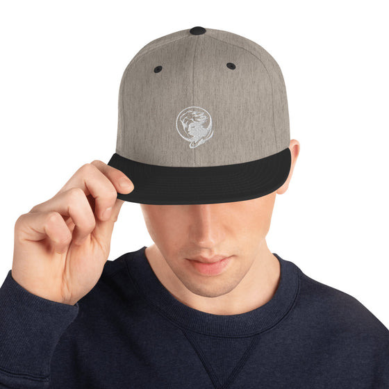 Gray baseball hat with logo of a man's face behind the moon