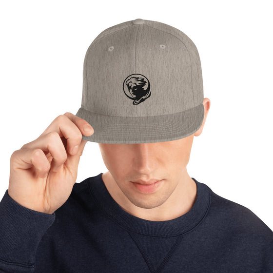 Gray baseball hat with logo of a man's face behind the moon
