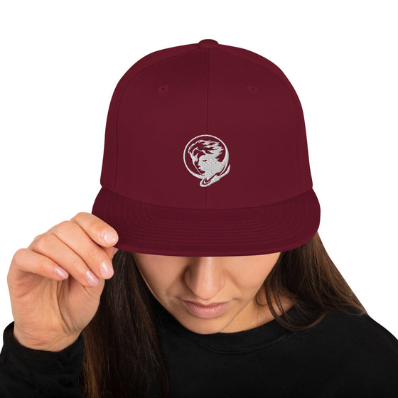 Maroon baseball hat with logo of a man's face behind the moon