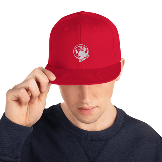 Red baseball hat with logo of a man's face behind the moon