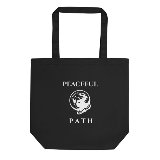 Black tote bag that says PEACEFUL PATH with a man's face behind the moon