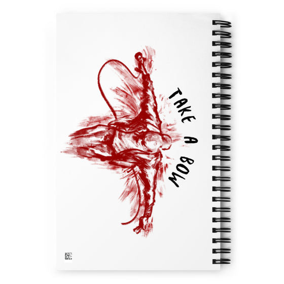White notebook with red colored graphic of rapper taking a bow after a performance. Overarching title says TAKE A BOW.