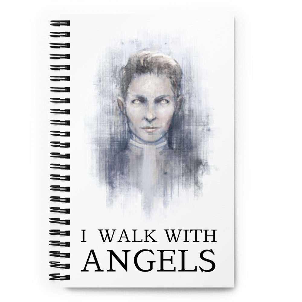  White notebook with an angelic figure. Title says I WALK WITH ANGELS.