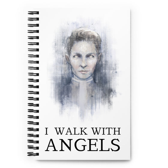White notebook with an angelic figure. Title says I WALK WITH ANGELS.