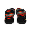 Designer flip flops of red and yellow streaking lights across a black background