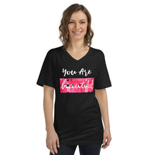  Black vneck t-shirt that says YOU ARE BEAUTIFUL with a photograph of a pink wall behind beautiful